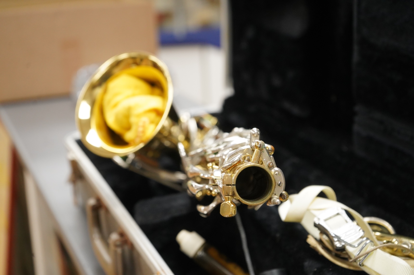A cased Buesohner Aristocrat alto saxophone